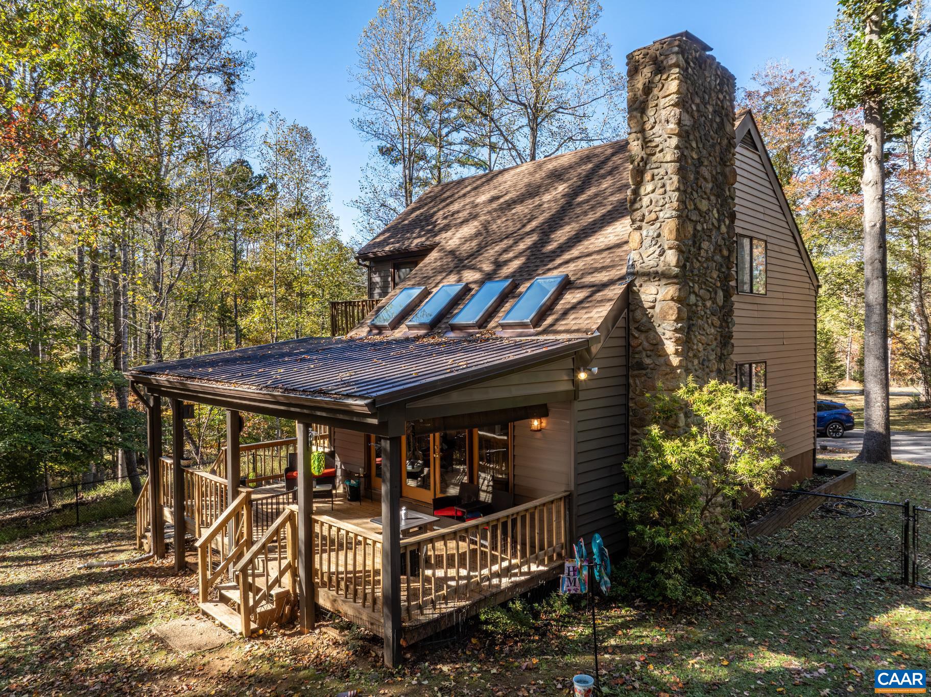 2530 Gillums Ridge Lane Charlottesville, VA 22903 - Photo 2 of 45 a view of a house with roof and wooden fence