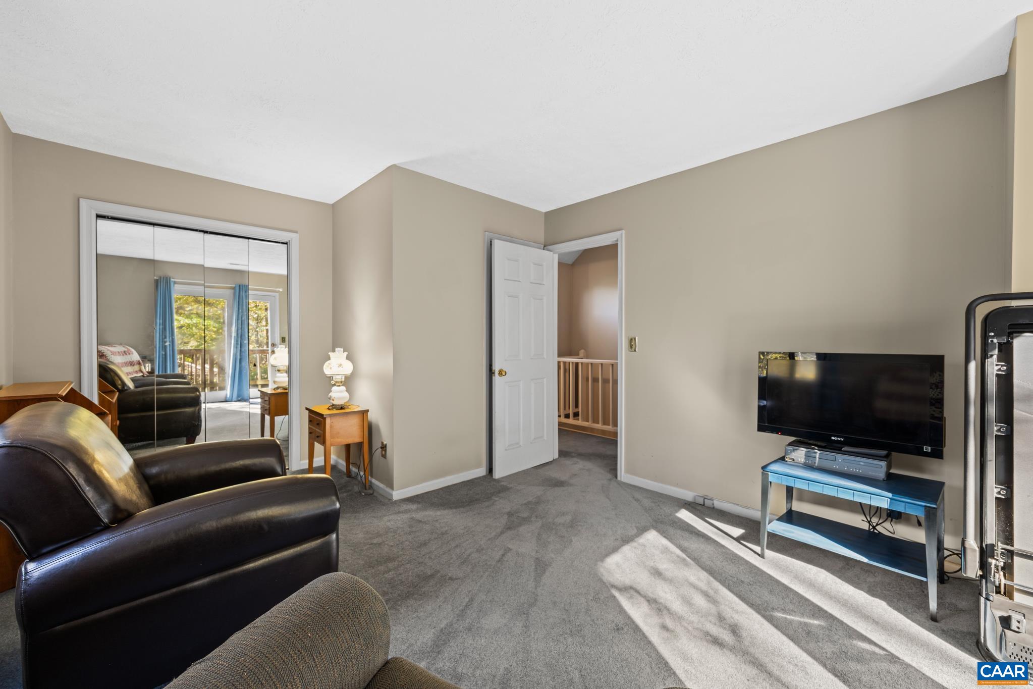 2530 Gillums Ridge Lane Charlottesville, VA 22903 - Photo 27 of 45 a living room with furniture and a flat screen tv