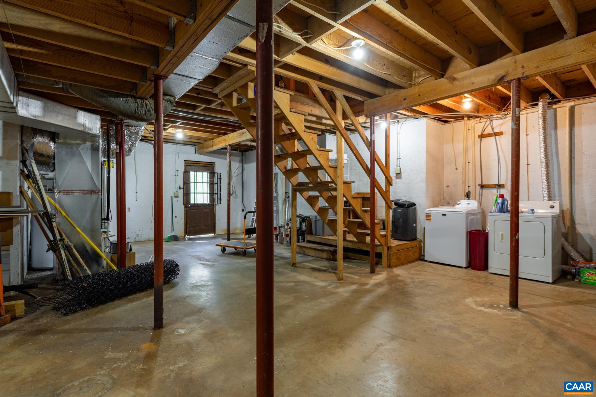 2530 Gillums Ridge Lane Charlottesville, VA 22903 - Photo 32 of 45 a view of an empty room with wooden floor