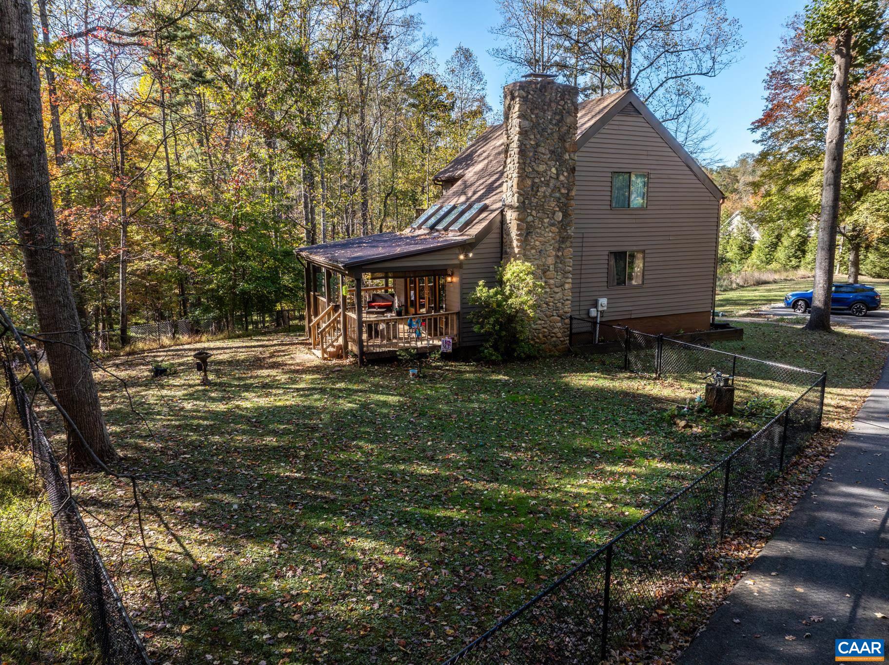 2530 Gillums Ridge Lane Charlottesville, VA 22903 - Photo 34 of 45 a front view of a house with garden