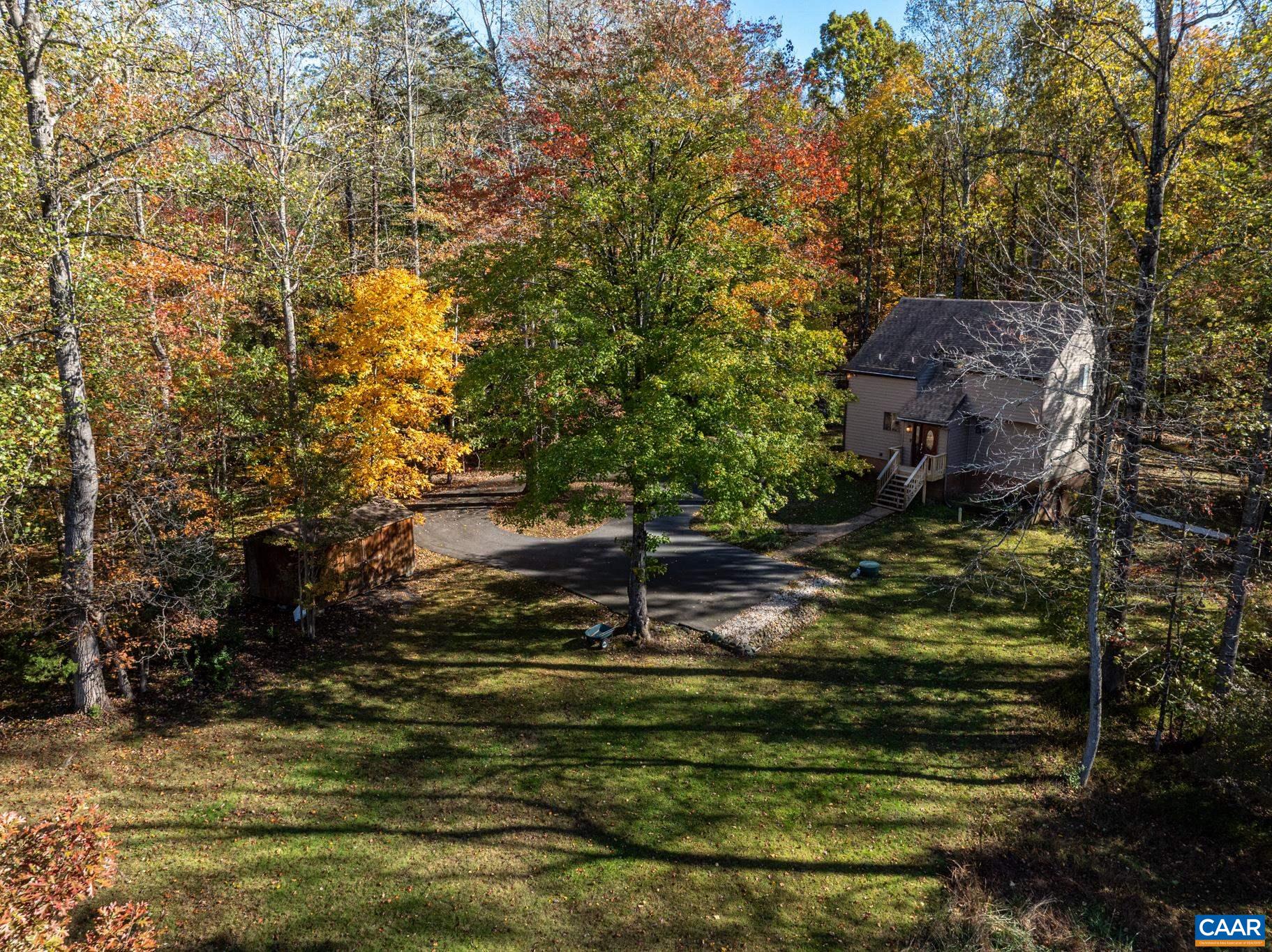 2530 Gillums Ridge Lane Charlottesville, VA 22903 - Photo 35 of 45 a backyard of a house with lots of green space