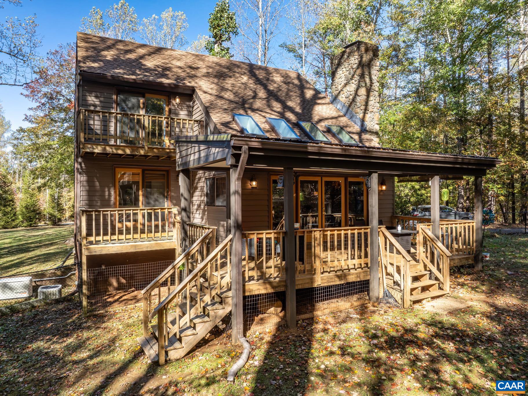 2530 Gillums Ridge Lane Charlottesville, VA 22903 - Photo 6 of 45 front view of a house with a deck