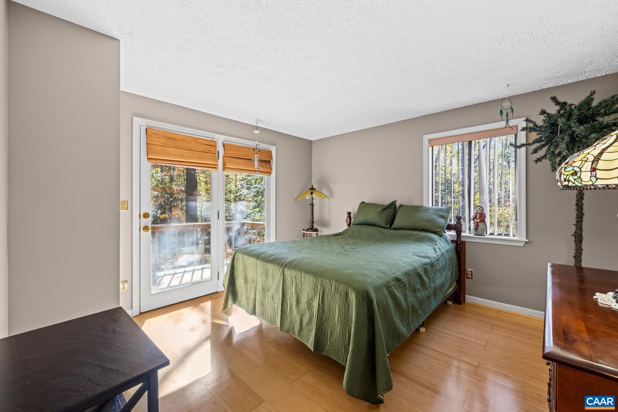 2530 Gillums Ridge Lane Charlottesville, VA 22903 - Photo 10 of 45 a bedroom with a bed and wooden floor