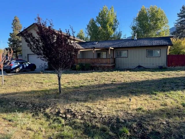 a view of a house with a yard