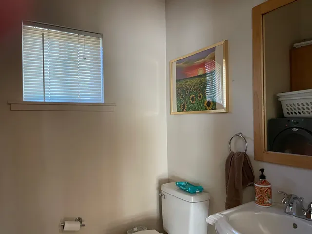 a bathroom with a toilet and a sink