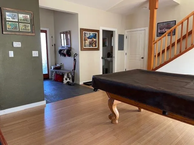 a living room with couch and a wooden floor