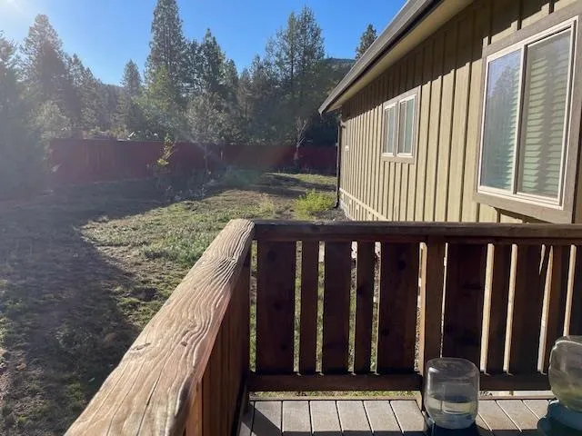 a view of balcony with wooden floor