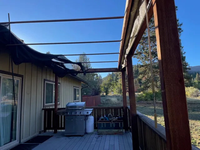 a view of balcony with furniture and wooden floor