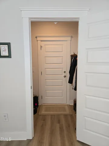a living room with furniture and floor to ceiling windows
