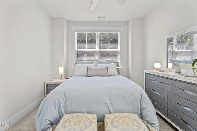 a bathroom with a double vanity sink mirror and shower