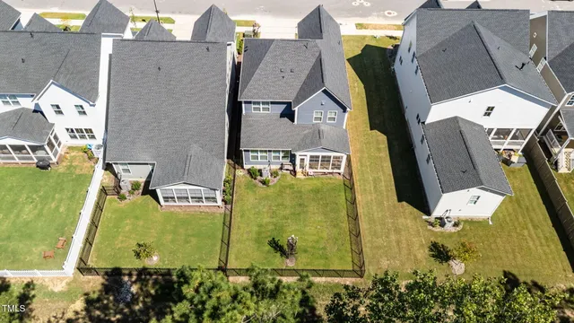 an aerial view of a house with swimming pool