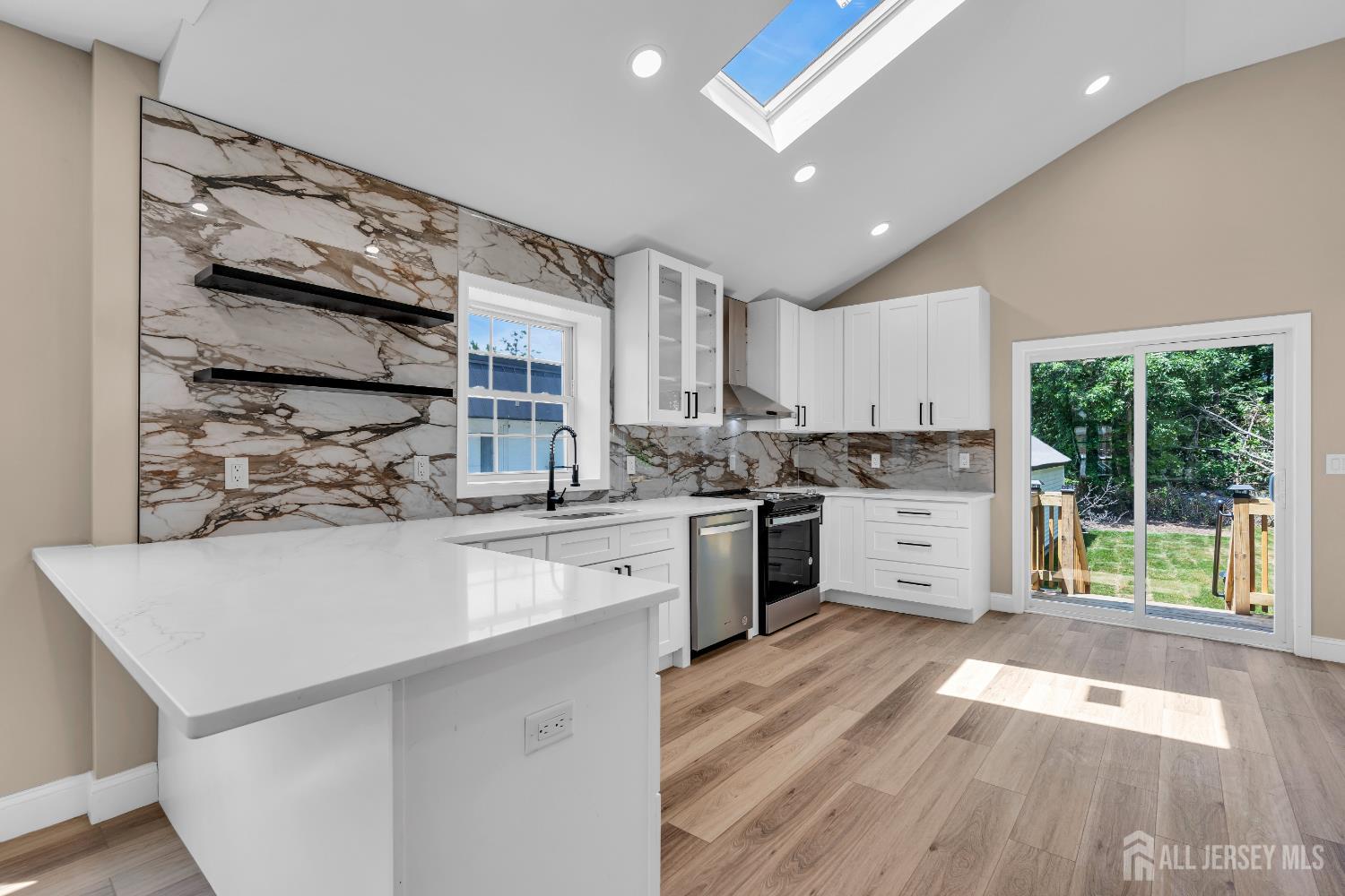 21 Harrison Avenue Englishtown, NJ 07726 - Photo 11 of 34 a kitchen with a sink wooden floor and window