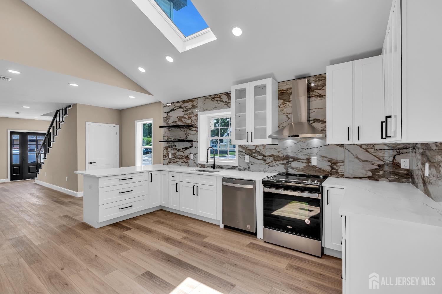 21 Harrison Avenue Englishtown, NJ 07726 - Photo 13 of 34 a kitchen with stainless steel appliances sink cabinets and wooden floor