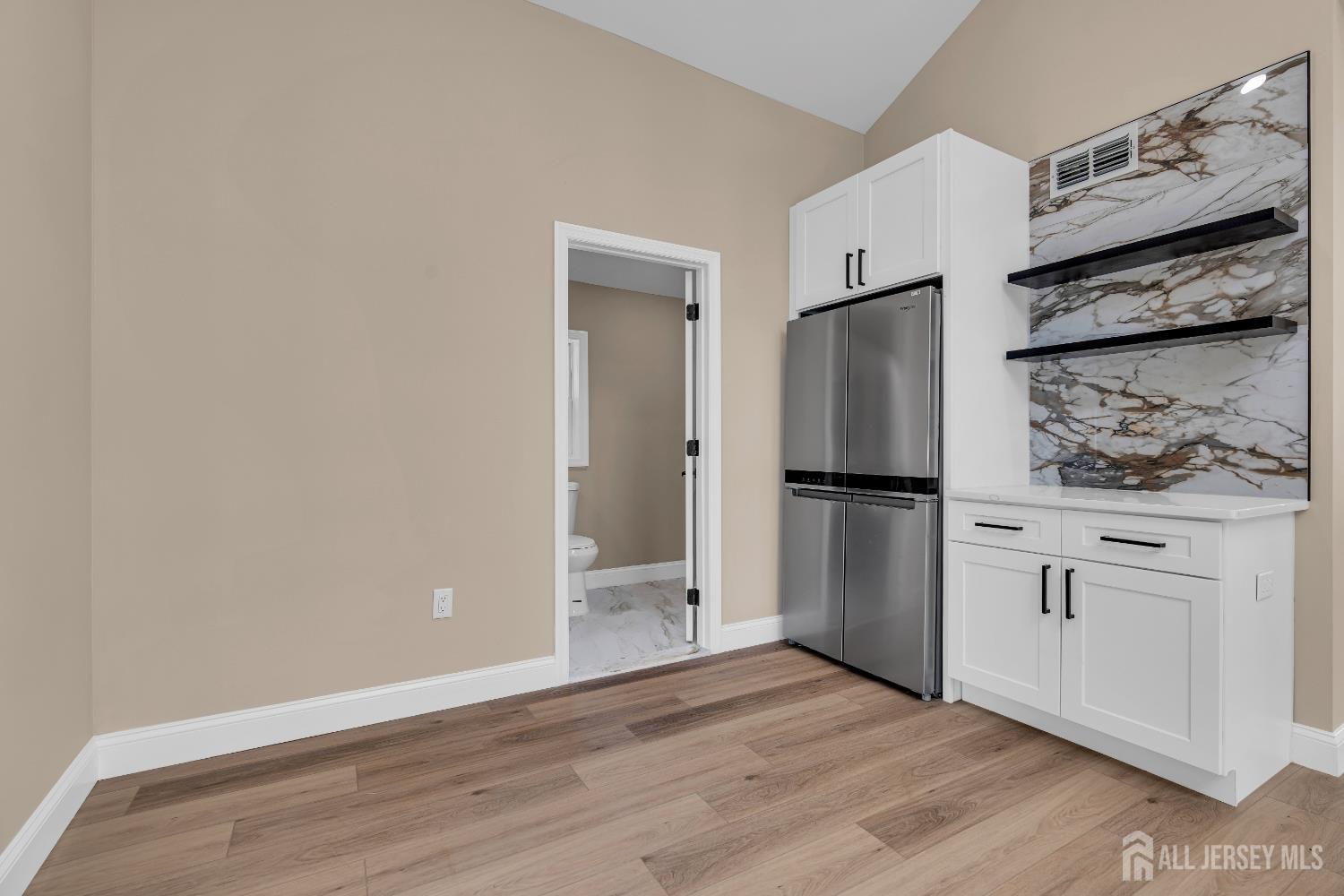 21 Harrison Avenue Englishtown, NJ 07726 - Photo 15 of 34 a kitchen with stainless steel appliances a refrigerator and a stove top oven