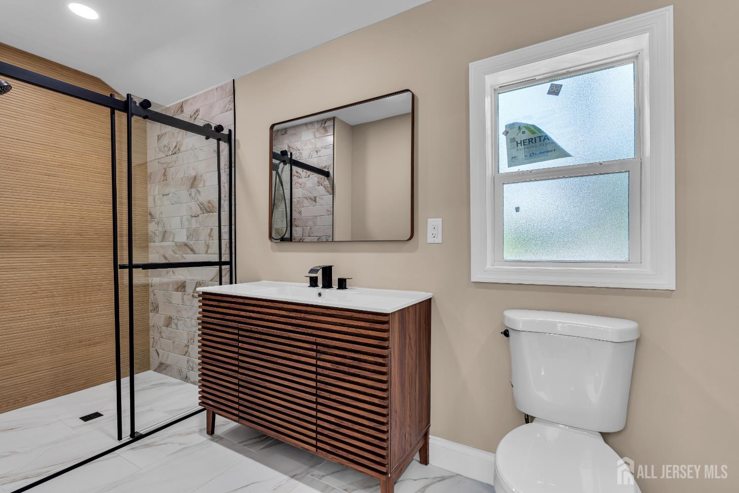21 Harrison Avenue Englishtown, NJ 07726 - Photo 16 of 34 a bathroom with a toilet a sink and mirror