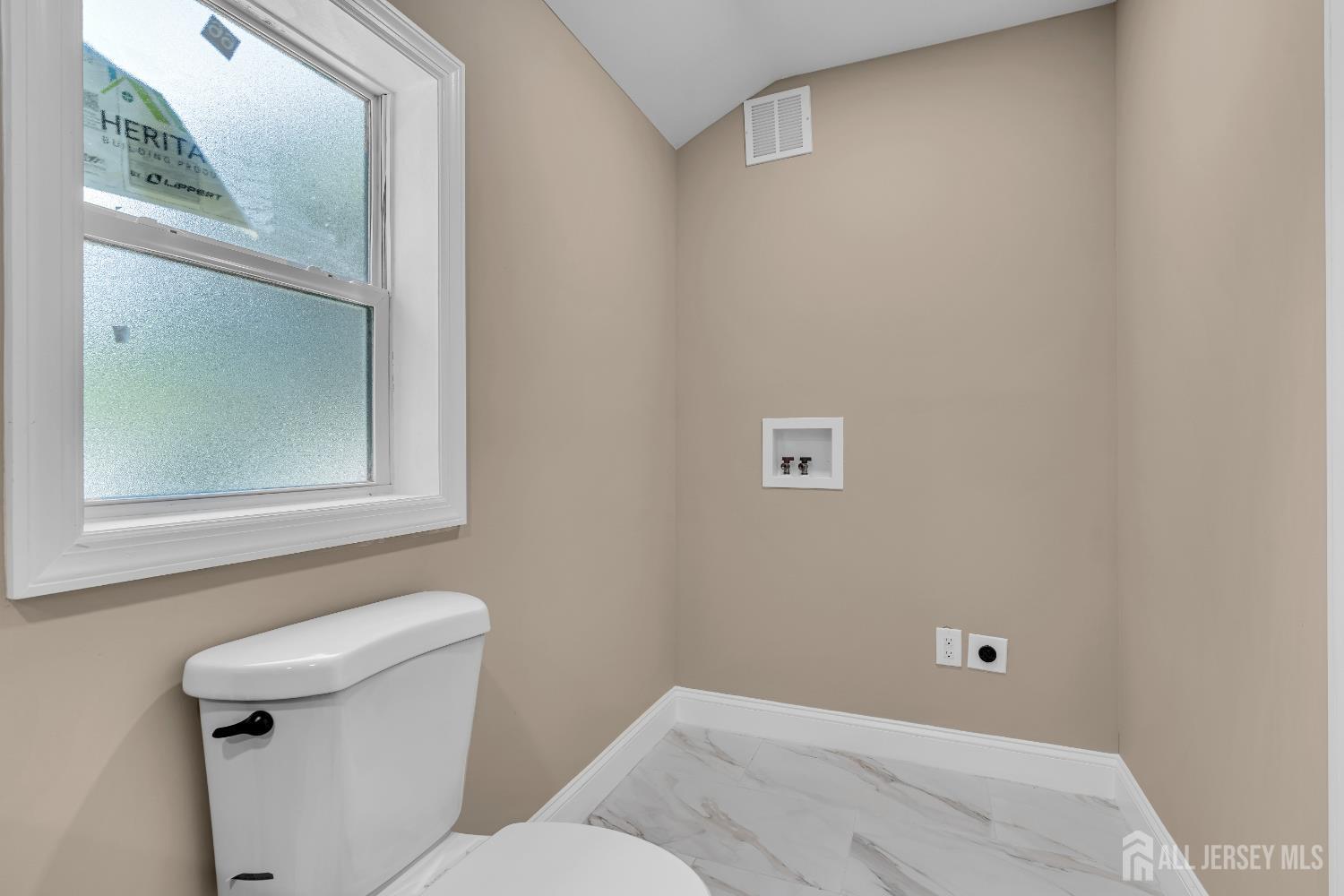 21 Harrison Avenue Englishtown, NJ 07726 - Photo 17 of 34 a bathroom with a toilet sink and mirror