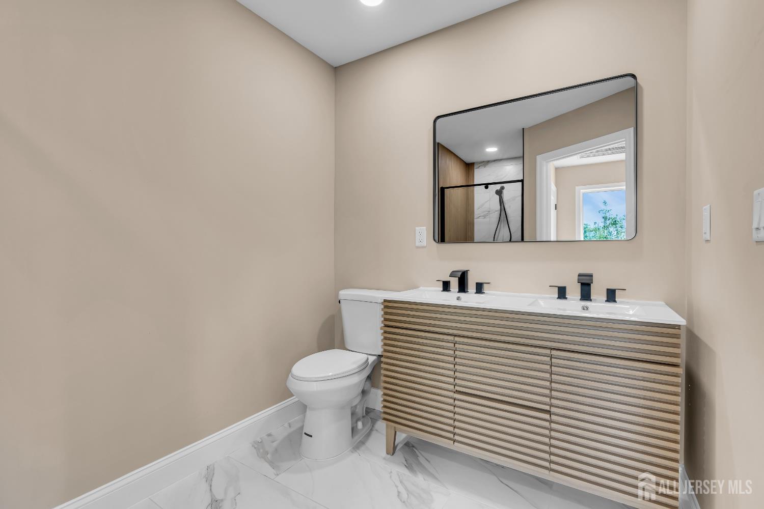 21 Harrison Avenue Englishtown, NJ 07726 - Photo 20 of 34 a bathroom with a toilet a sink and mirror