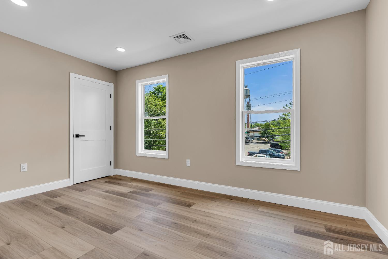 21 Harrison Avenue Englishtown, NJ 07726 - Photo 23 of 34 a view of an empty room with wooden floor and a window