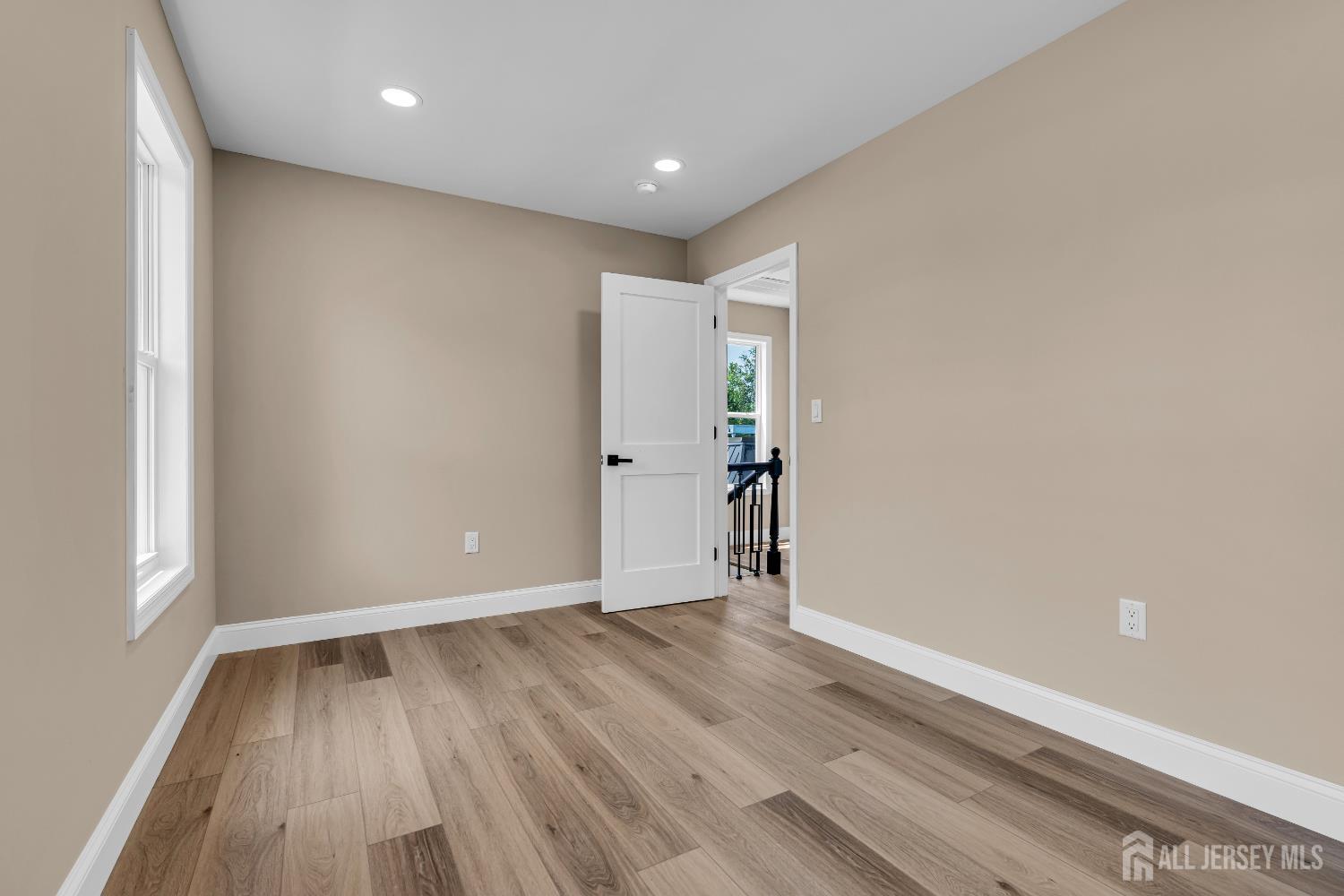 21 Harrison Avenue Englishtown, NJ 07726 - Photo 24 of 34 a view of an empty room with wooden floor