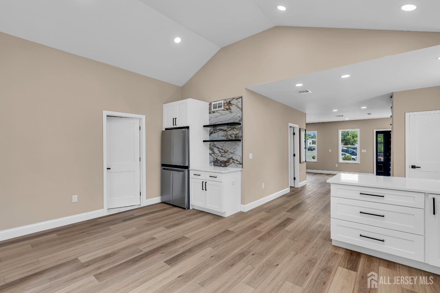 21 Harrison Avenue Englishtown, NJ 07726 - Photo 29 of 34 a kitchen with stainless steel appliances wooden floor and floors
