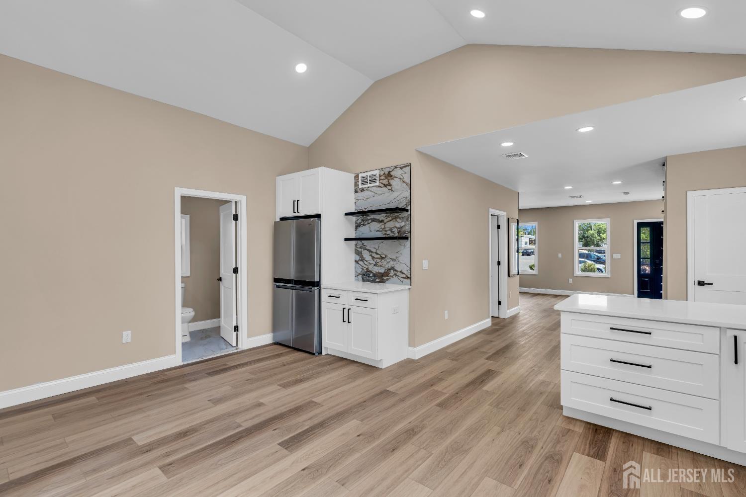 21 Harrison Avenue Englishtown, NJ 07726 - Photo 30 of 34 a kitchen with stainless steel appliances cabinets and wooden floor