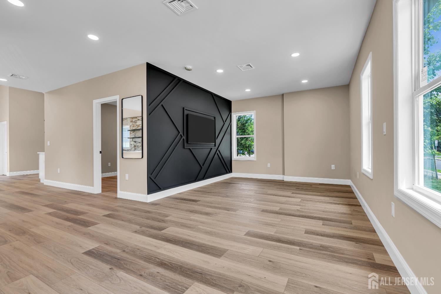 21 Harrison Avenue Englishtown, NJ 07726 - Photo 3 of 34 a view of empty room with wooden floor and fan