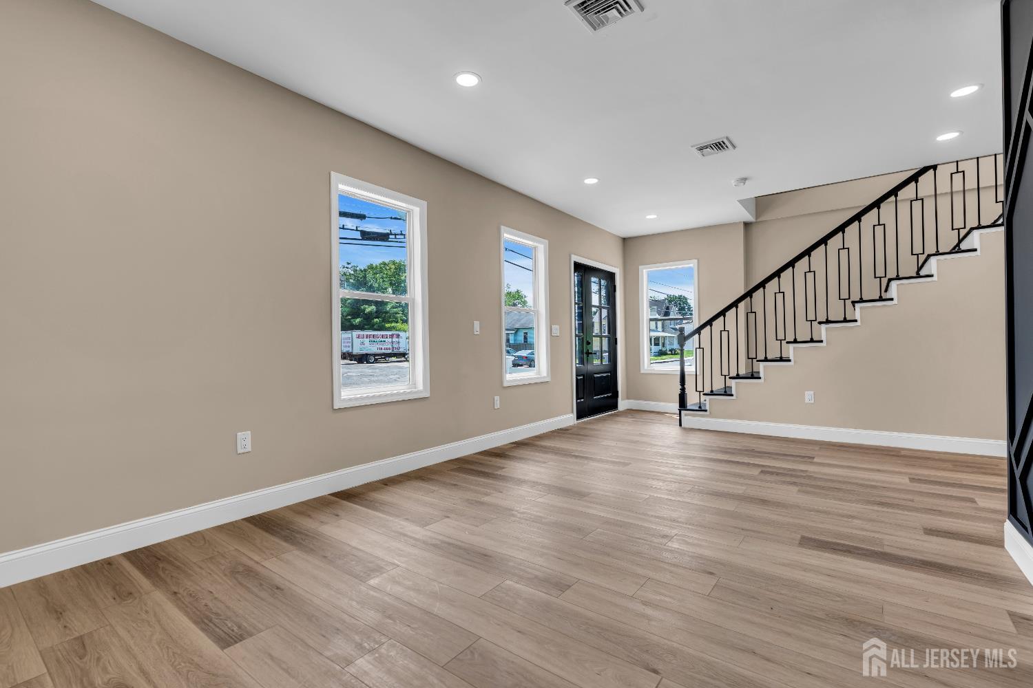 21 Harrison Avenue Englishtown, NJ 07726 - Photo 5 of 34 a view of an empty room with wooden floor and a window