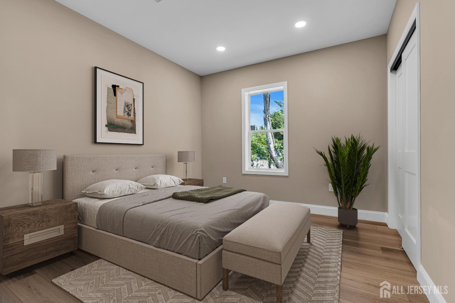 21 Harrison Avenue Englishtown, NJ 07726 - Photo 7 of 34 a bedroom with a large bed and a potted plant
