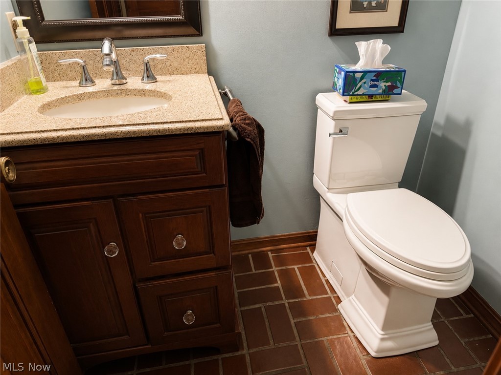 6155 Gibson Road Canfield, OH 44406 - Photo 17 of 43 Bathroom featuring a vanity with a light-toned stone countertop, undermount sink, and chrome faucet