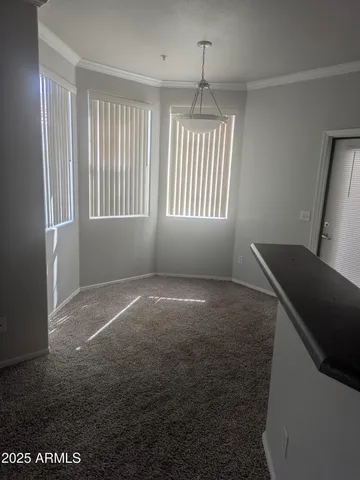 a white toilet sitting next to a shower