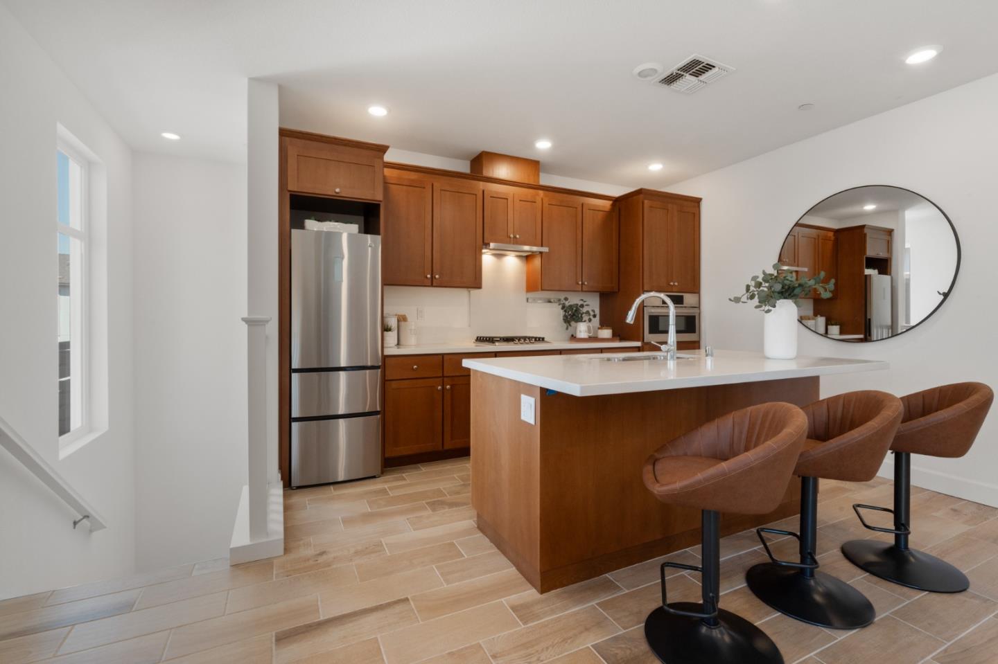 39447 Finial Common Fremont, CA 94539 - Photo 13 of 48 a kitchen with stainless steel appliances granite countertop a refrigerator and a sink