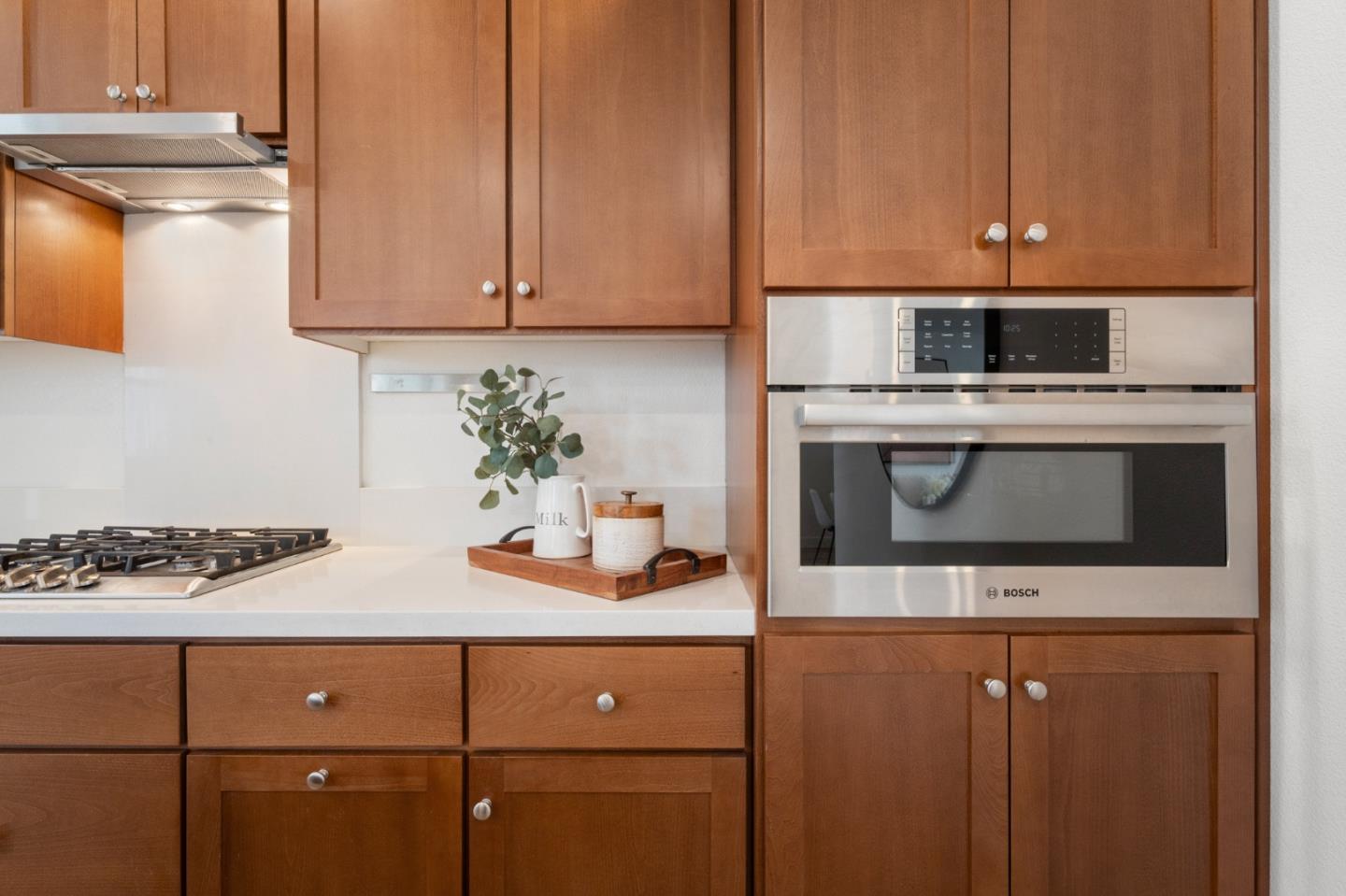 39447 Finial Common Fremont, CA 94539 - Photo 14 of 48 a kitchen with stainless steel appliances a stove a microwave and cabinets