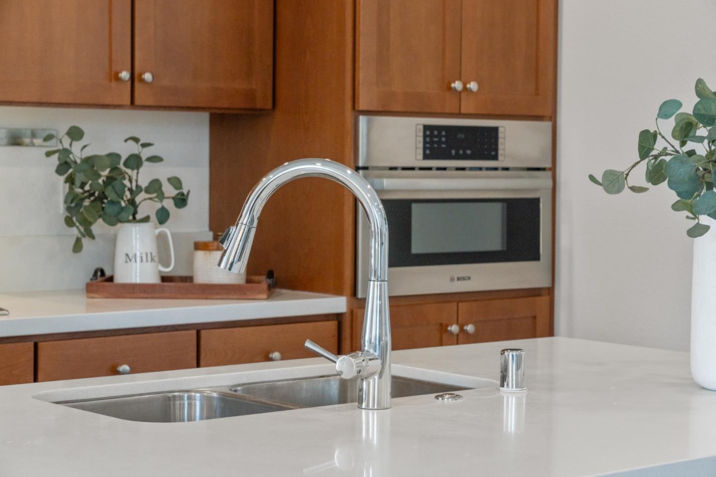 39447 Finial Common Fremont, CA 94539 - Photo 15 of 48 a kitchen with stainless steel appliances granite countertop a sink a stove and cabinets