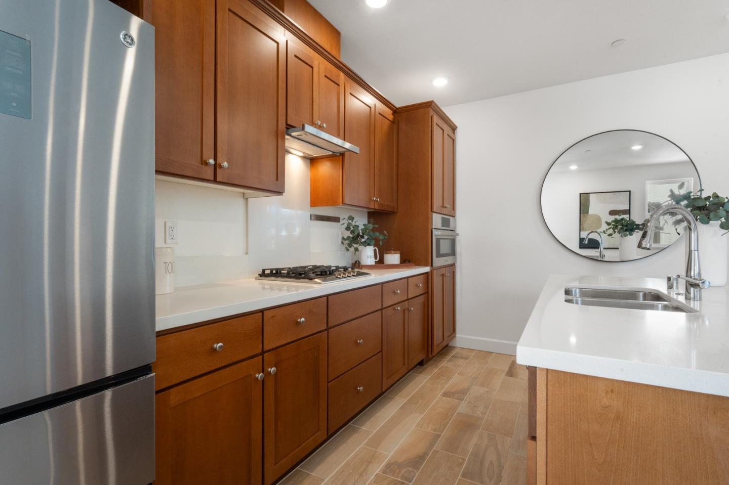 39447 Finial Common Fremont, CA 94539 - Photo 16 of 48 a kitchen with a sink stove and cabinets