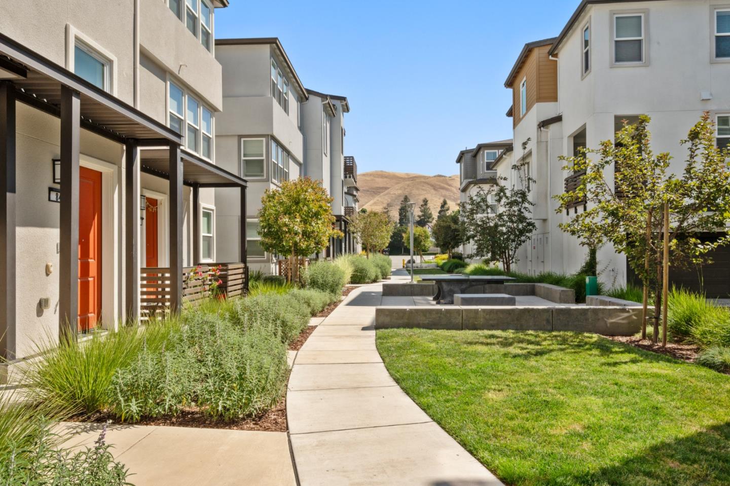 39447 Finial Common Fremont, CA 94539 - Photo 2 of 48 a front view of a house with a yard