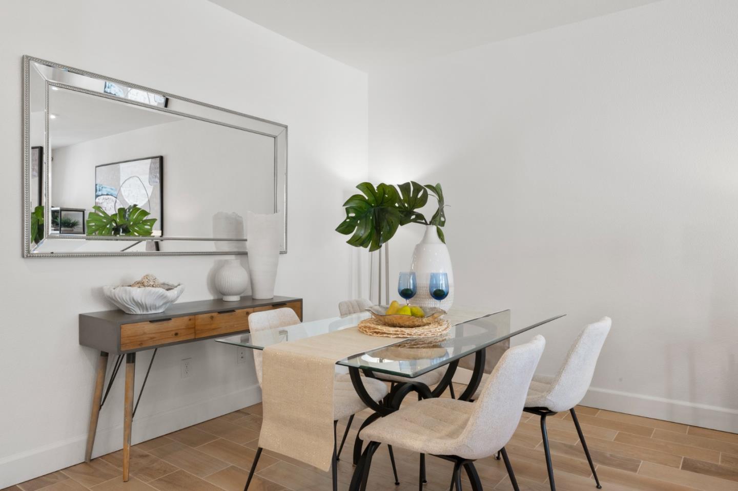39447 Finial Common Fremont, CA 94539 - Photo 23 of 48 a view of a dining room with furniture and wooden floor