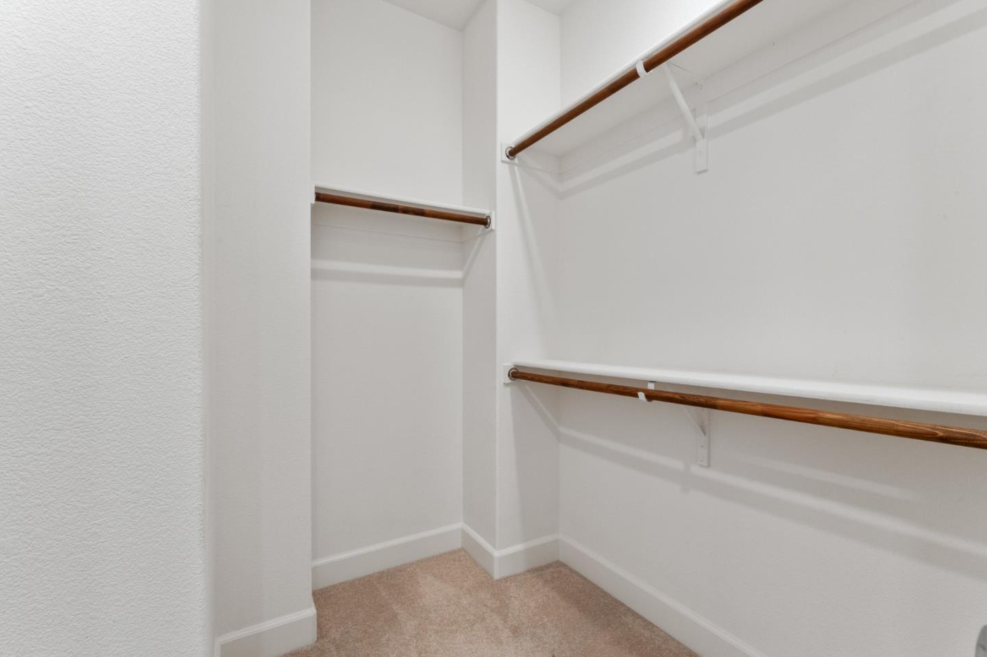 39447 Finial Common Fremont, CA 94539 - Photo 28 of 48 a view of walk in closet with empty racks