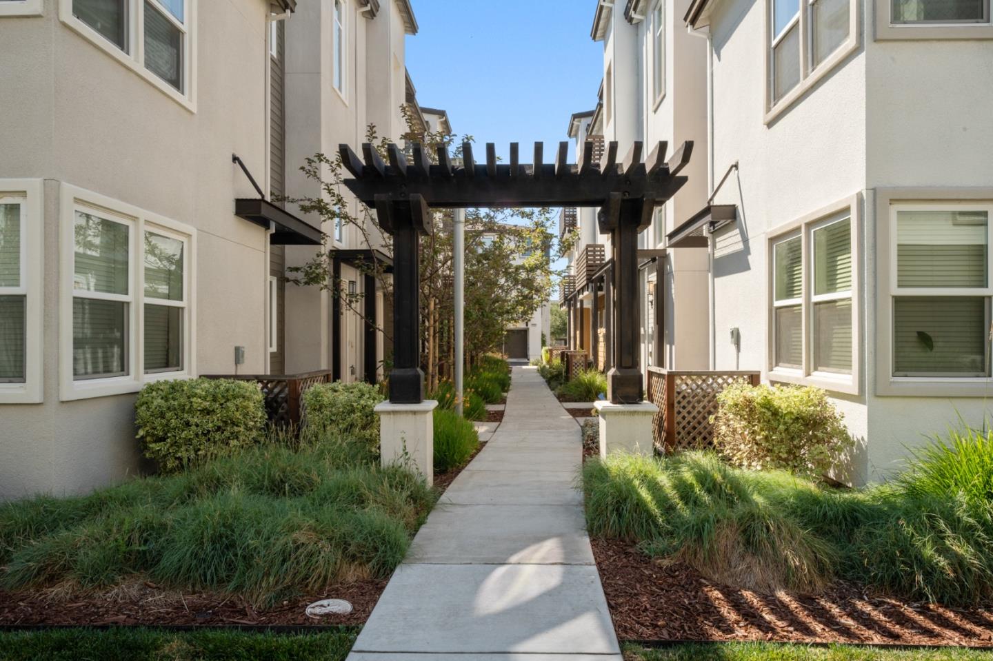 39447 Finial Common Fremont, CA 94539 - Photo 3 of 48 a view of a house with fountain and potted plants