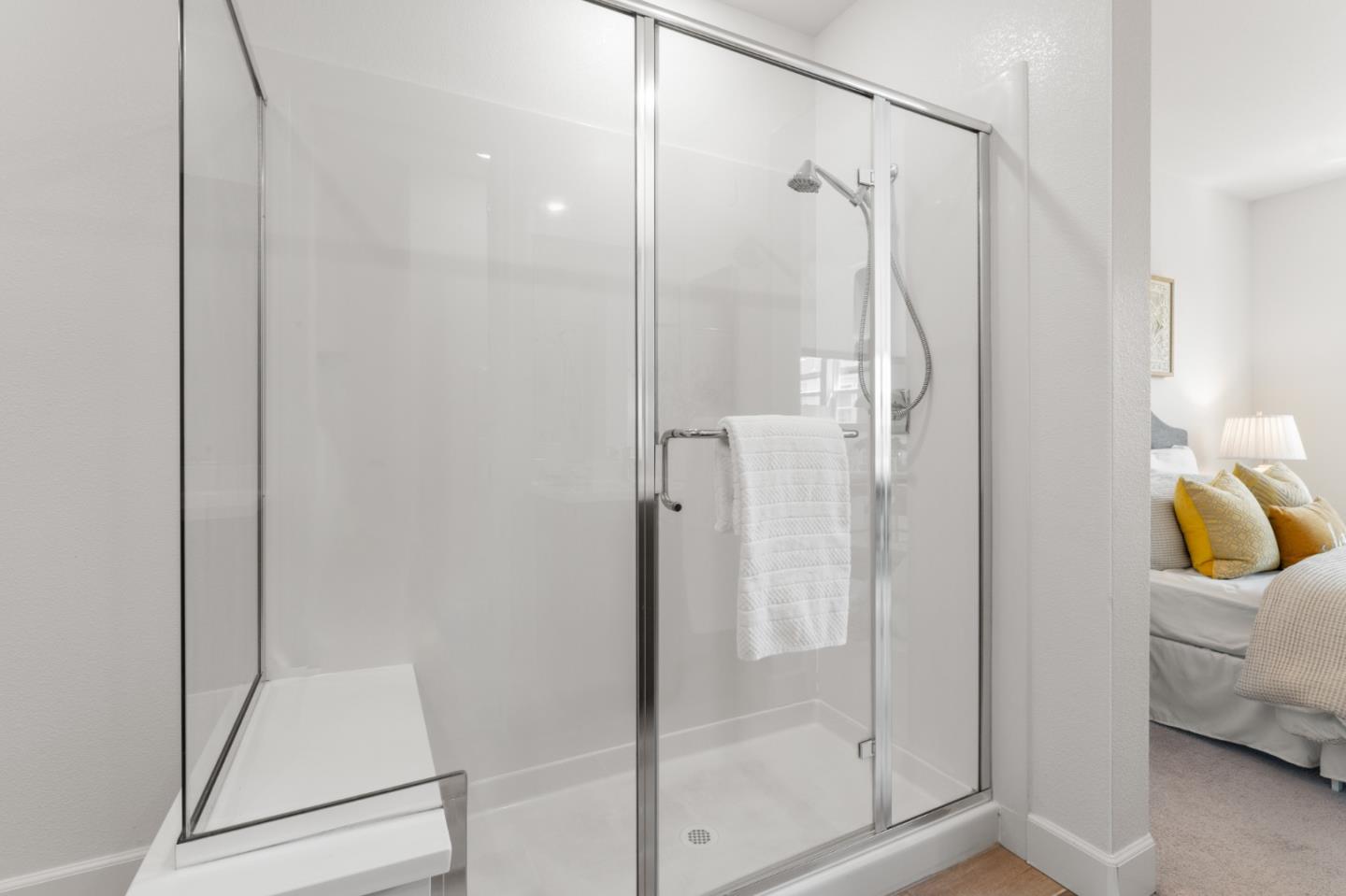 39447 Finial Common Fremont, CA 94539 - Photo 34 of 48 a bathroom that has a glass shower door