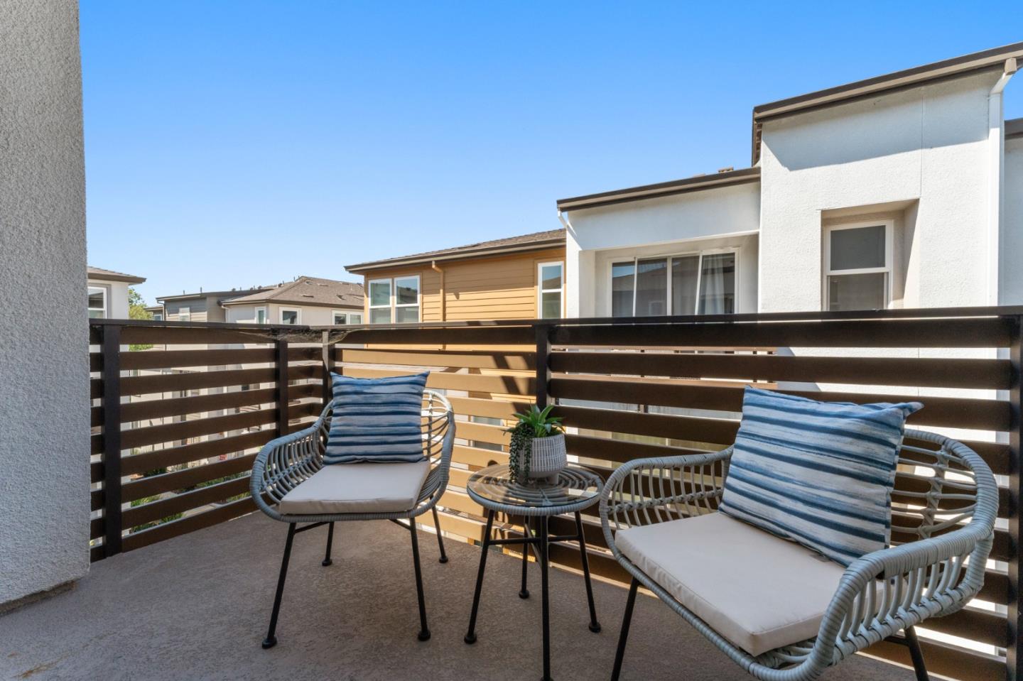 39447 Finial Common Fremont, CA 94539 - Photo 38 of 48 a view of a chairs and table in the back yard