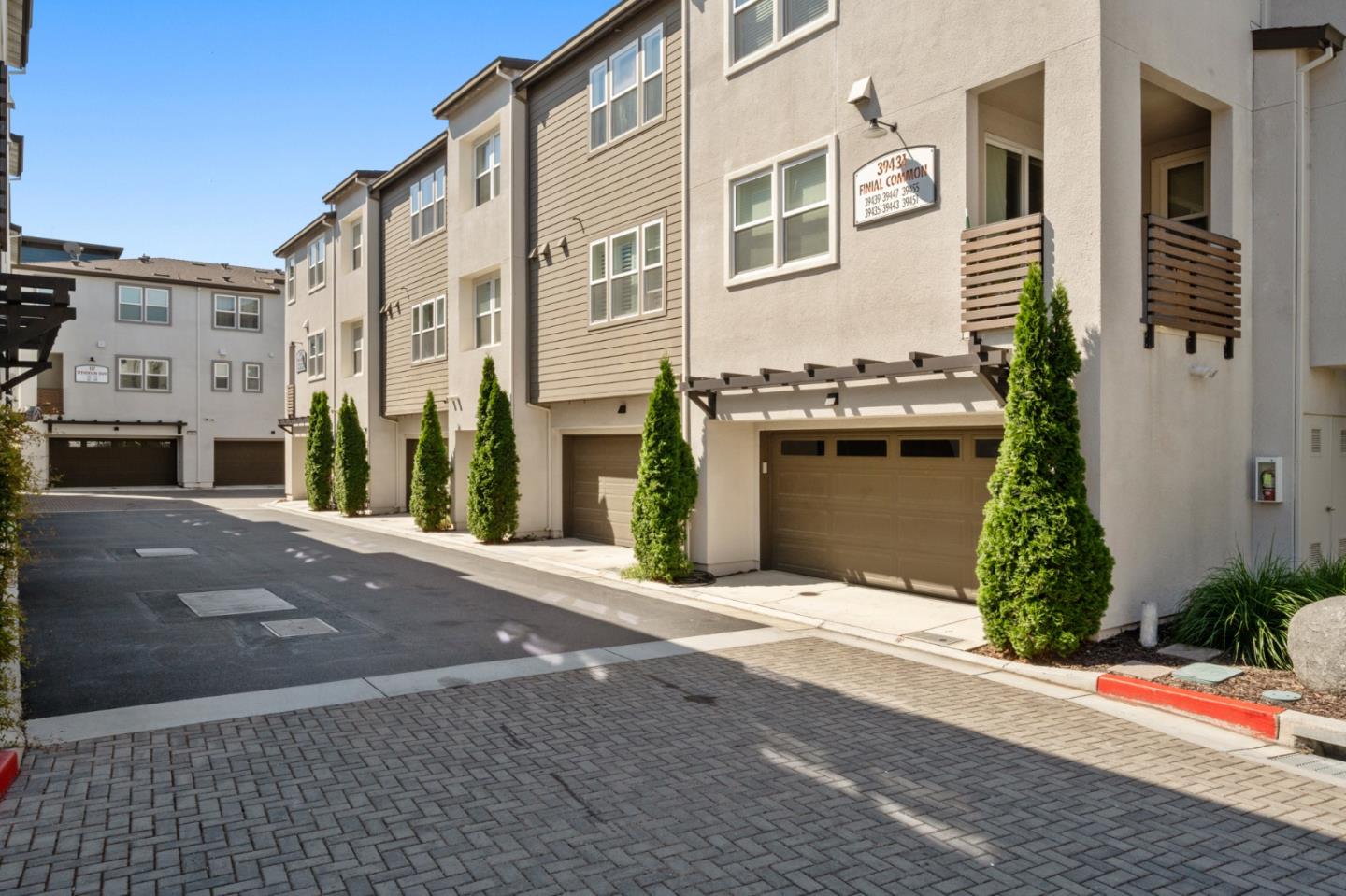 39447 Finial Common Fremont, CA 94539 - Photo 40 of 48 a front view of a building with a yard