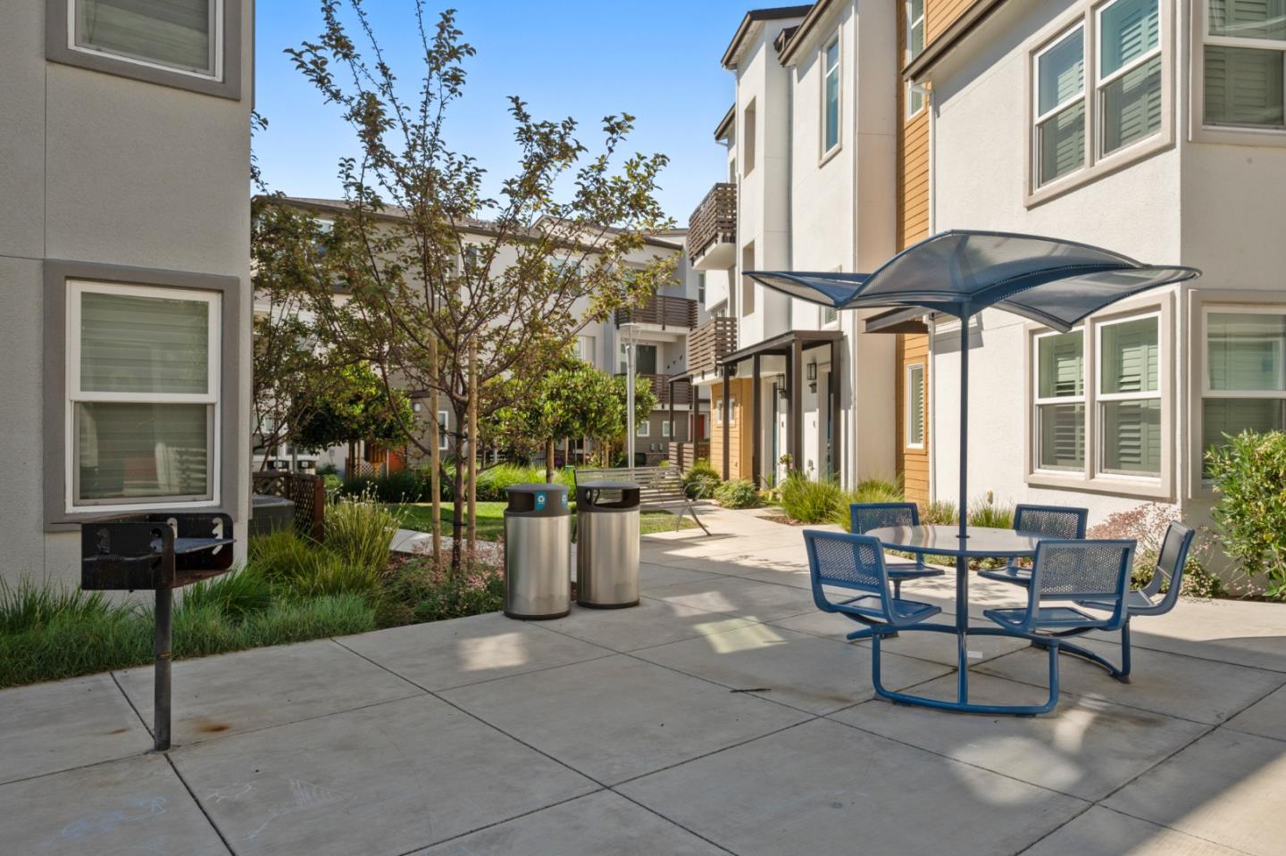 39447 Finial Common Fremont, CA 94539 - Photo 41 of 48 a view of a patio with table and chairs and potted plants