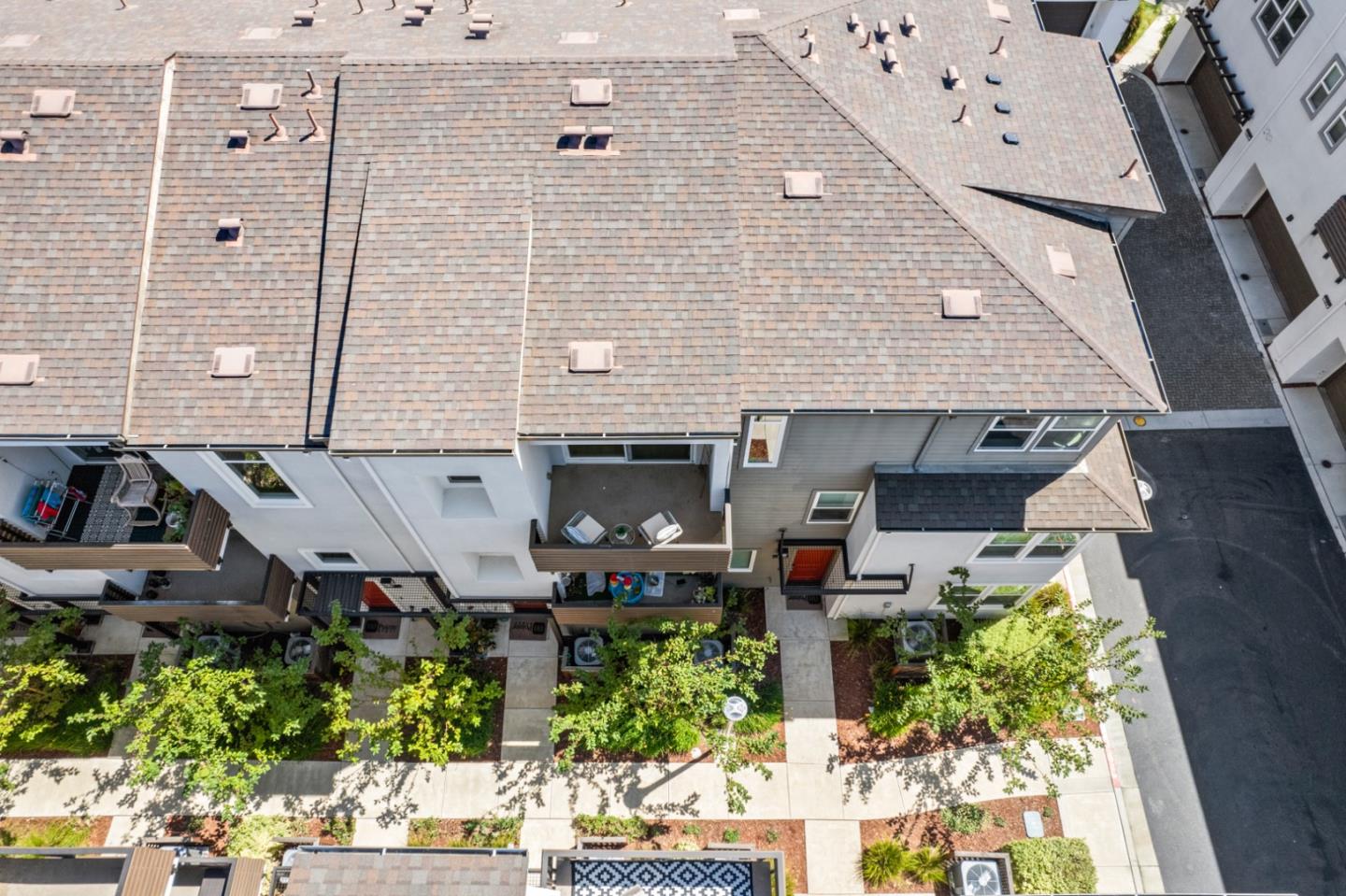39447 Finial Common Fremont, CA 94539 - Photo 42 of 48 an aerial view of a house with a yard and potted plants