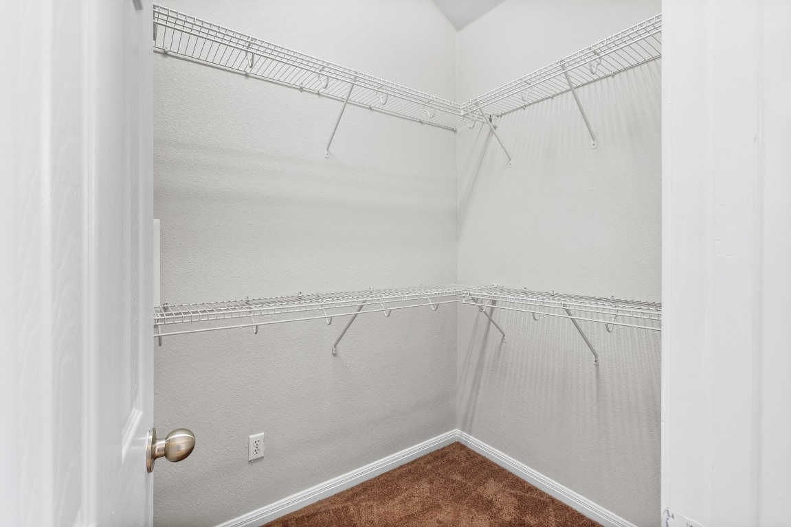 236 Caddis Cove Kyle, TX 78640 - Photo 11 of 17 a view of a room with racks on the wall