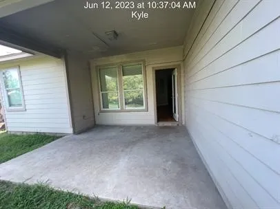 a view of a backyard with a tree