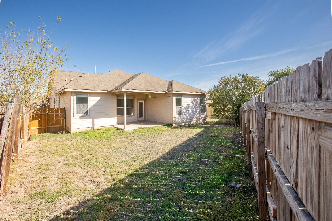 236 Caddis Cove Kyle, TX 78640 - Photo 17 of 17 a front view of a house with a garden