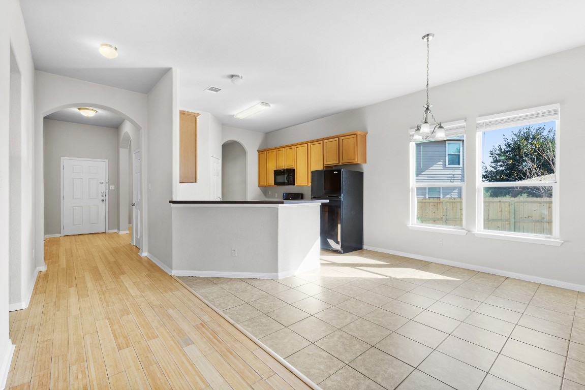 236 Caddis Cove Kyle, TX 78640 - Photo 3 of 17 a view of a kitchen with furniture and a window