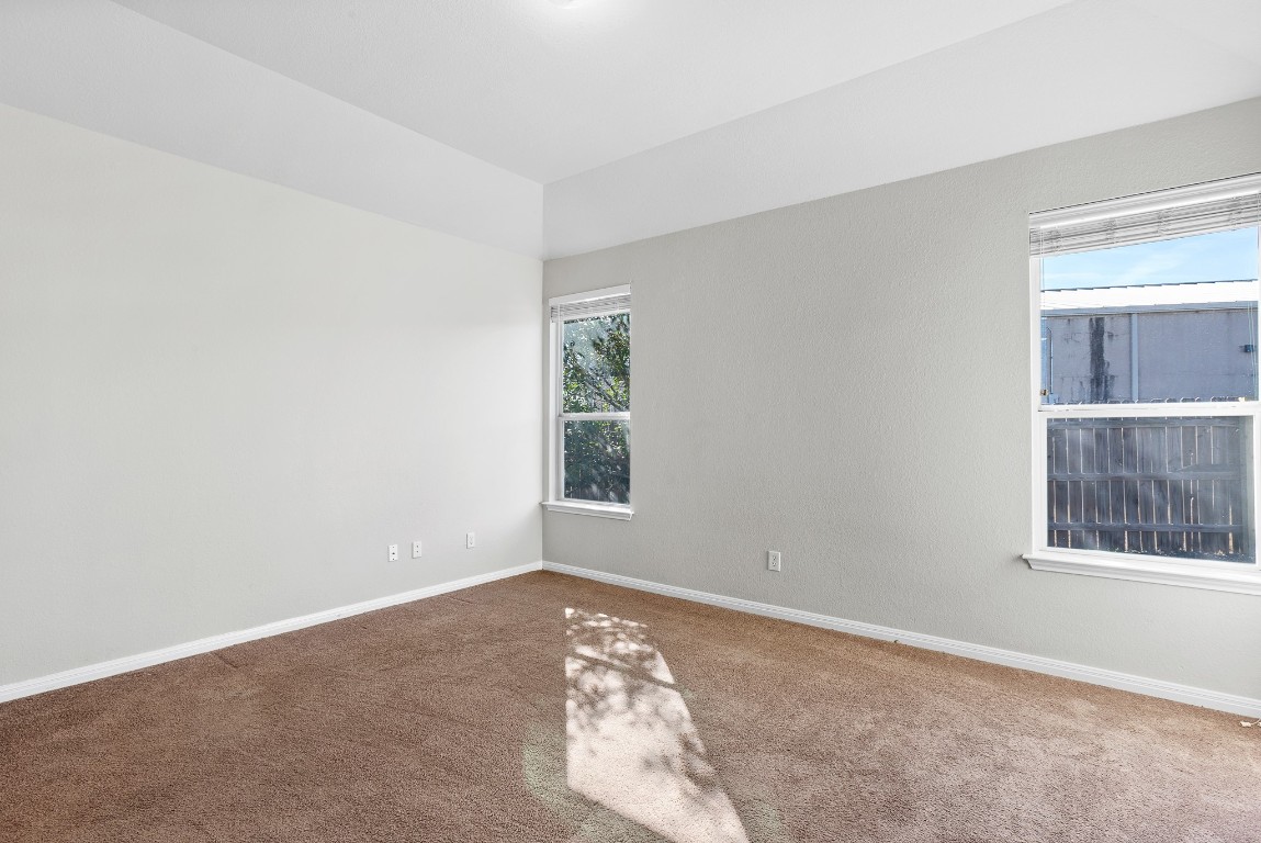 236 Caddis Cove Kyle, TX 78640 - Photo 7 of 17 an empty room with windows