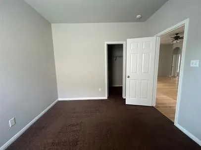an empty room with closet area