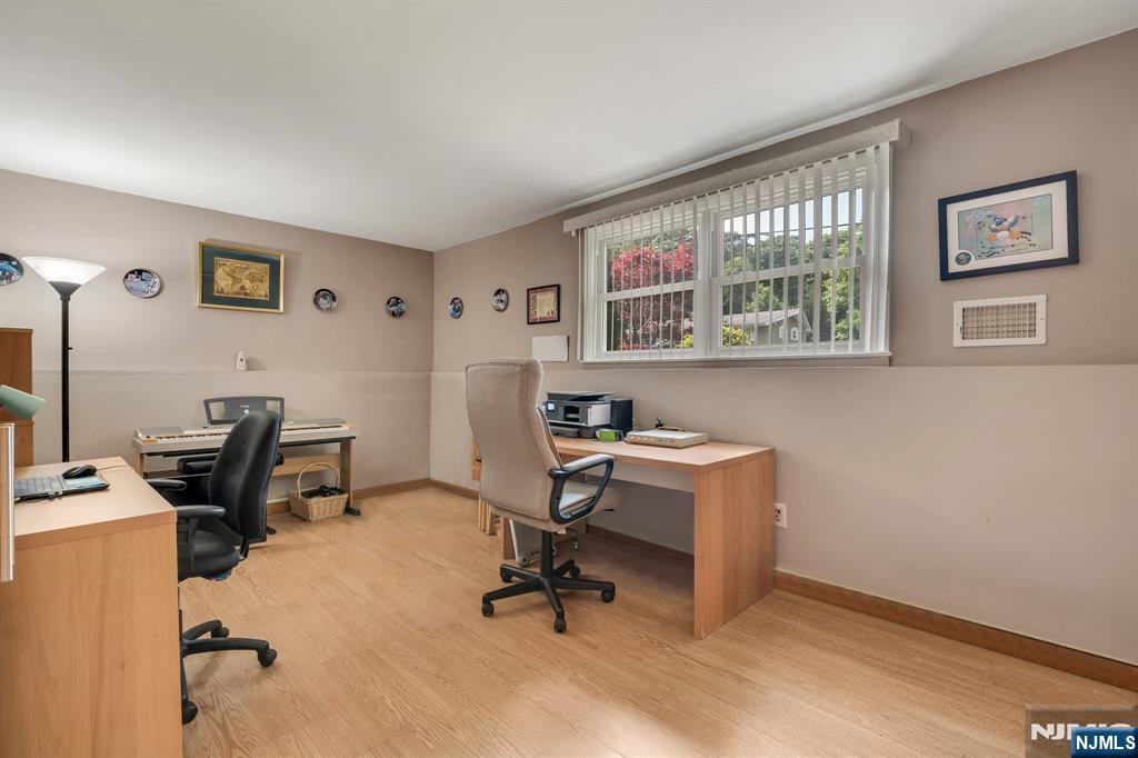 55 Marcia Road Ringwood, NJ 07456 - Photo 23 of 42 a view of a workspace with furniture and a window